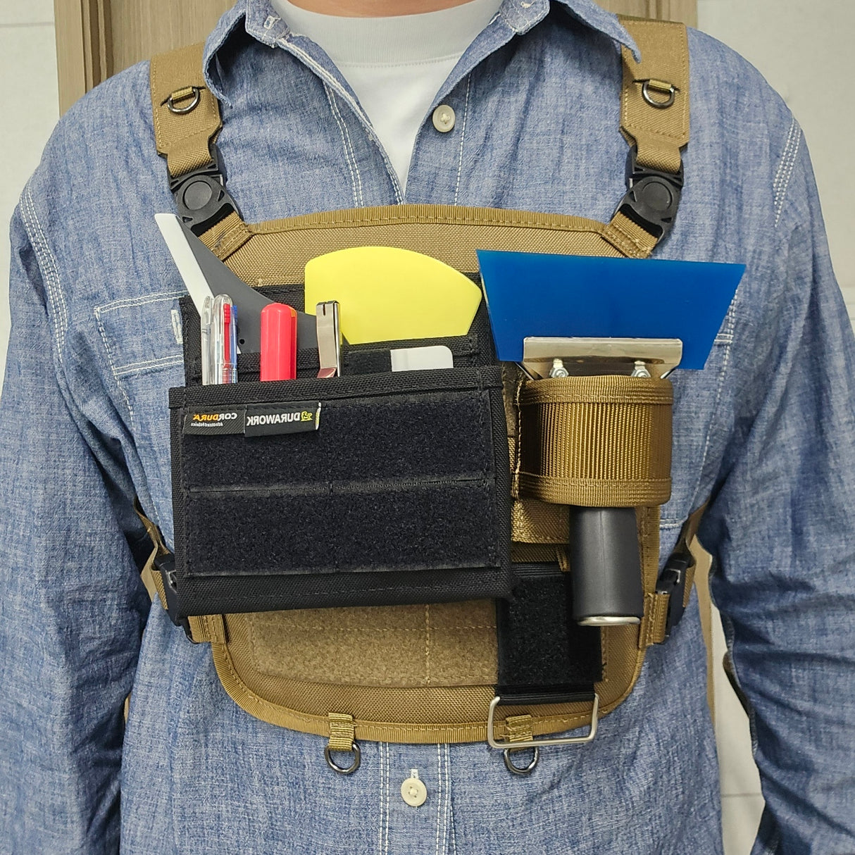 Versatile DURAWORK 405 Pouch mounted on a chest panel, providing quick access to tinting tools and squeegees.