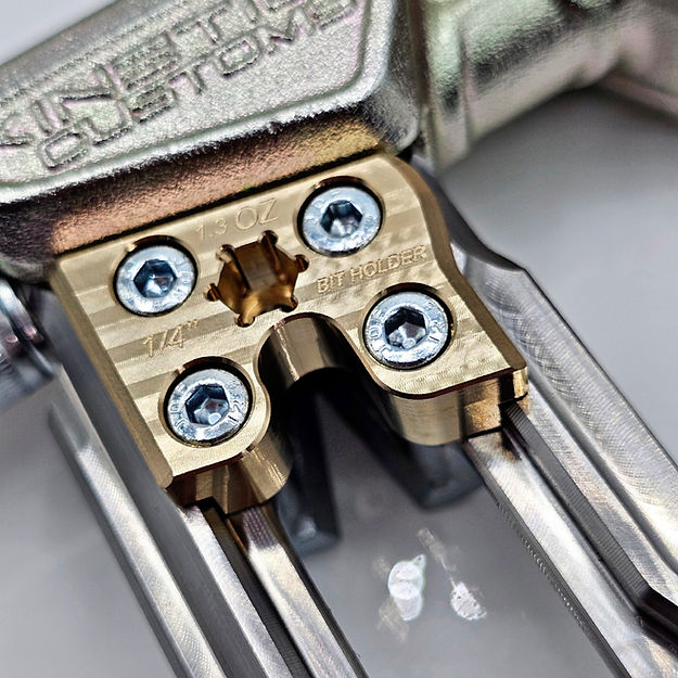 The Kinetic Customs Nighthawk Brass Weight being installed over the side nail puller on a Nighthawk Evo hammer shaft.