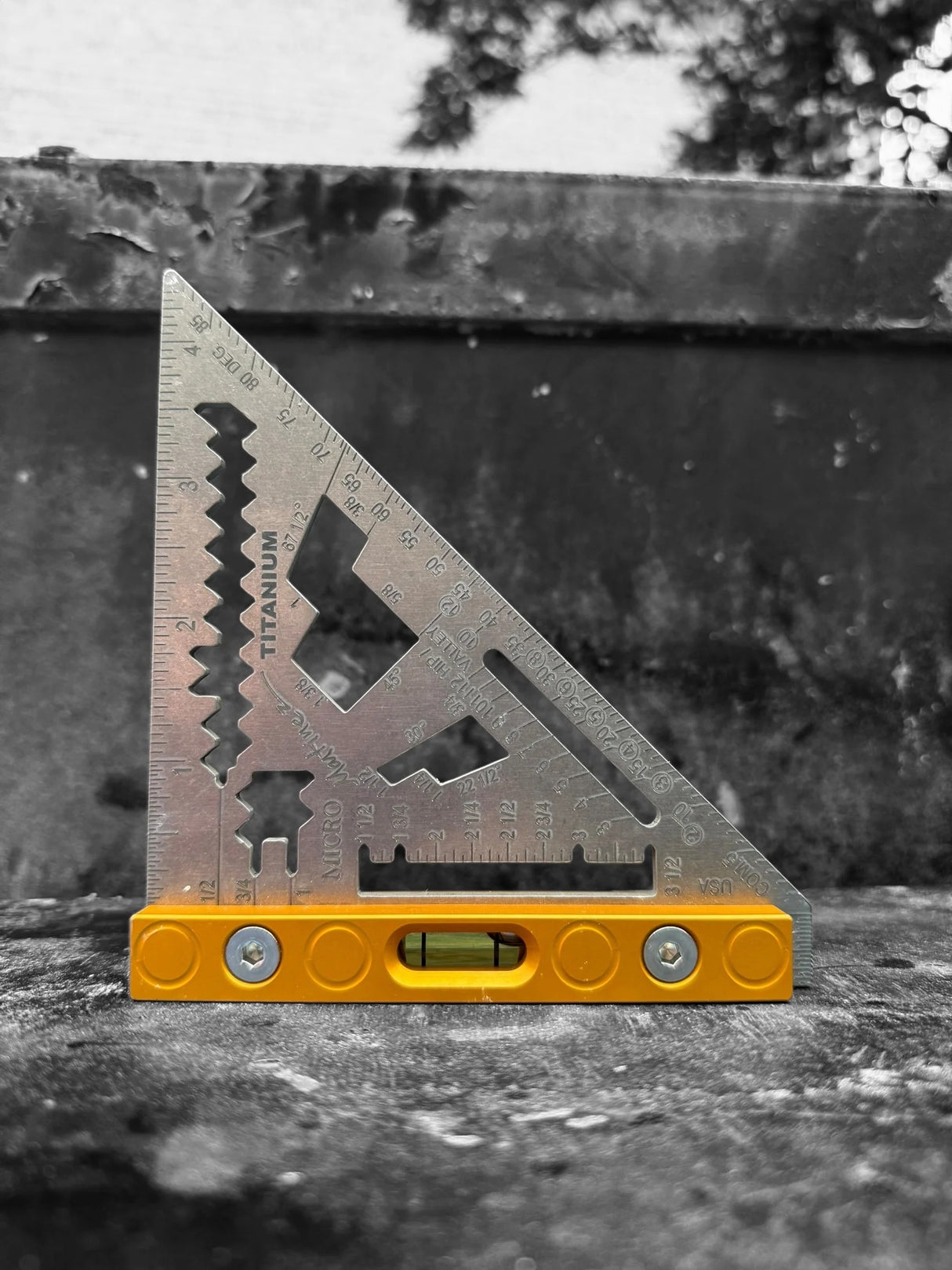 Close-up of the high-visibility laser-etched markings on the robust 0.125-inch thick Martinez Titanium Micro Square blade.