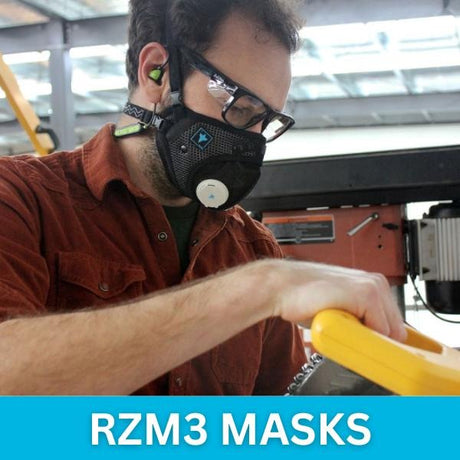 A professional wearing the RZ Mask RZM3 with safety glasses, demonstrating its fog-free vision guarantee.