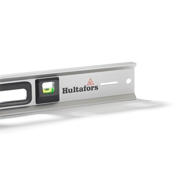 The unique slots in the Hultafors MST spirit level's profile, designed for fastening to a wall for hands-free use.