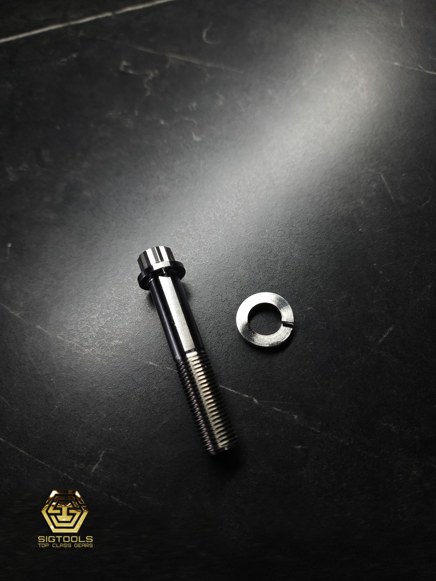 Side view of a Martinez 12-point Titanium Replacement Bolt for M1 & M4 Steel Heads with the washer removed.