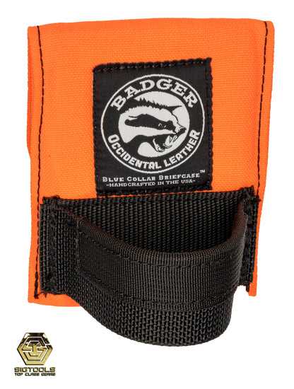 The high-visibility orange Badger hammer loop designed to secure a hammer or similar tool for easy access and convenience while working.