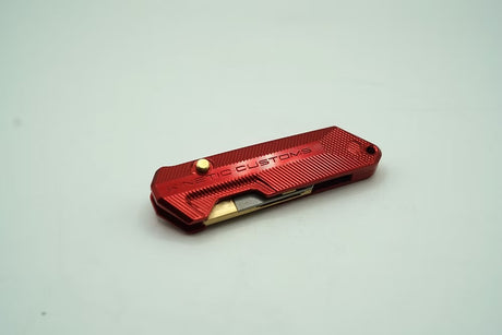 The innovative magnetic spare blade storage inside the handle of the Kinetic Customs Reaper utility tool.