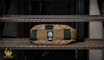 A Sawdust Sage Badger Belt, securely fastened, demonstrating its functionality as a tool belt designed to conveniently organize a variety of tools and accessories.