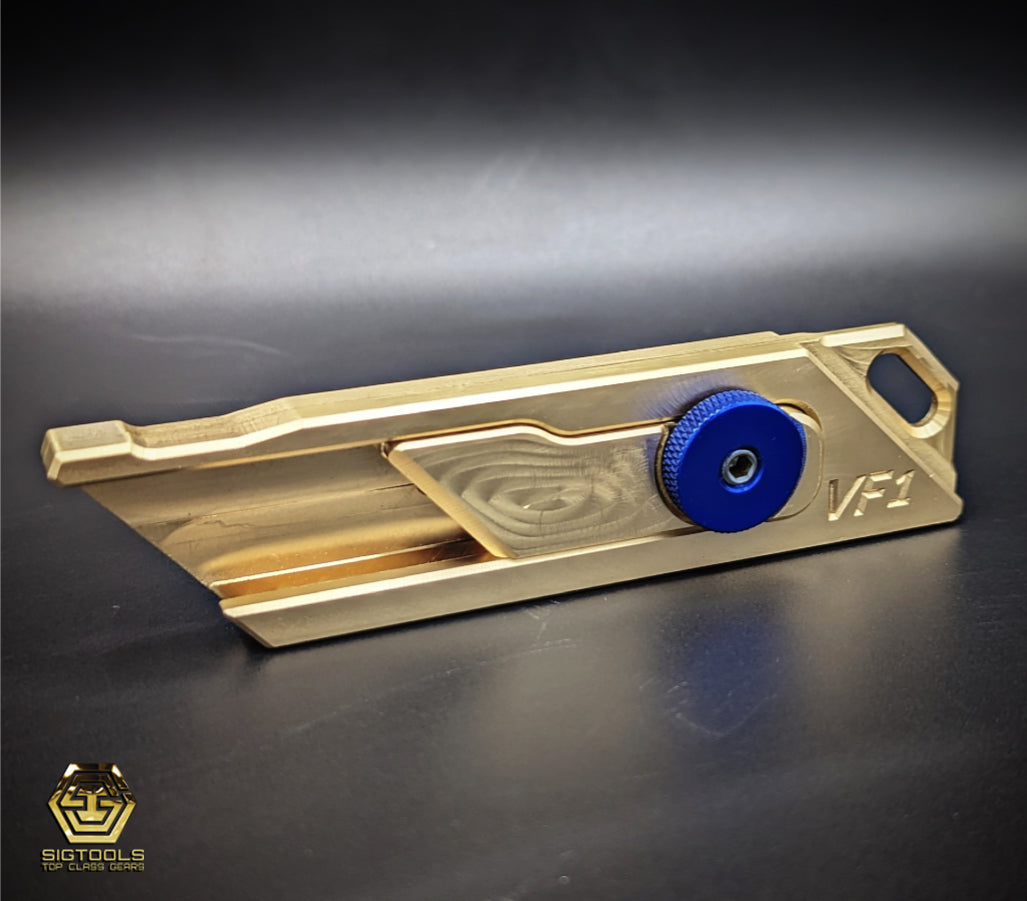 Kinetic Customs Brass VF1 Utility Body with a Blue wheel.