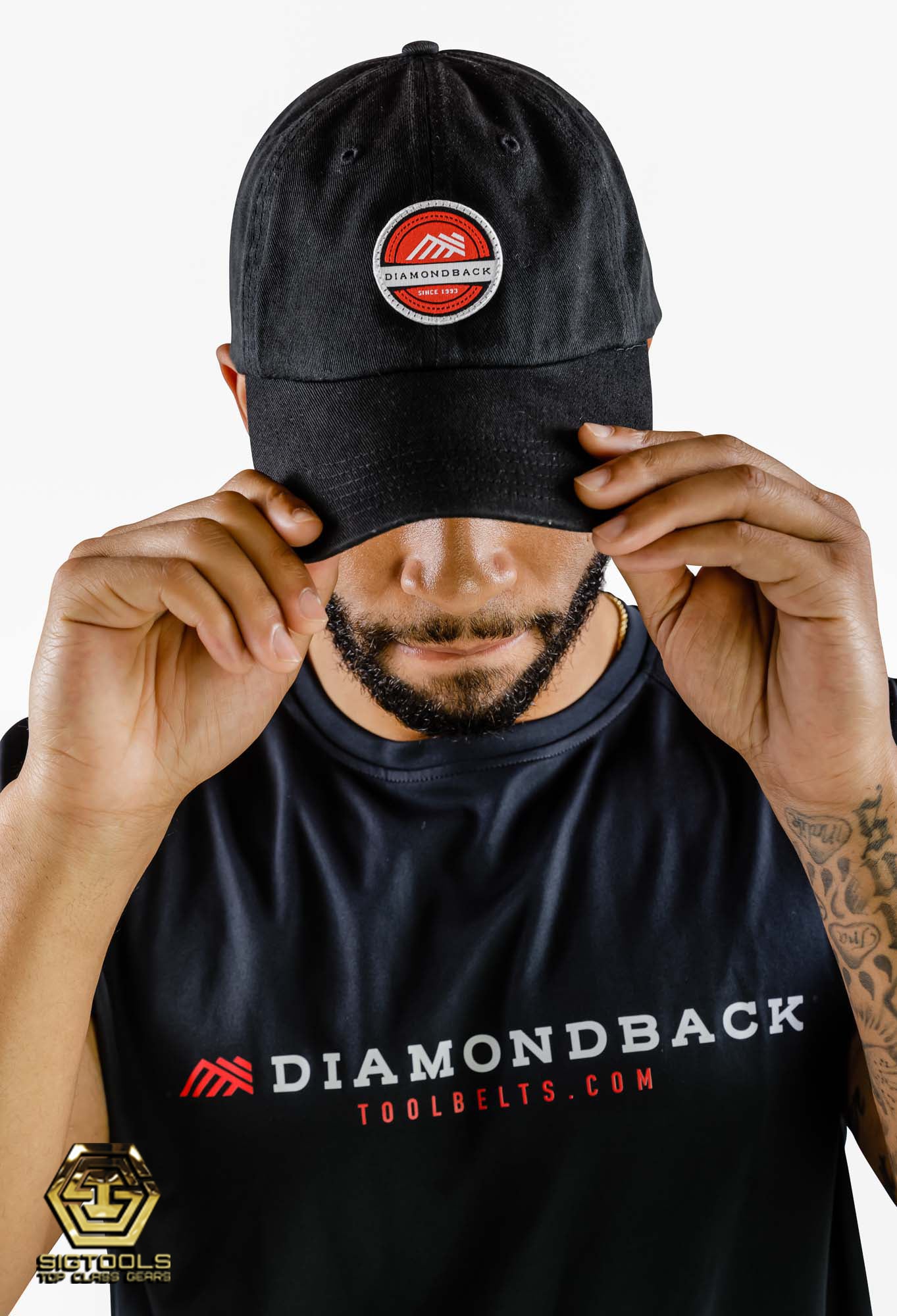 A person wearing a Diamondback red dad hat with the brand's logo on the front, showcasing the hat's style and fit when worn. 
