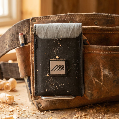 Close-up showing the Diamondback HD clip used to attach the wallet securely to a pants pocket edge.